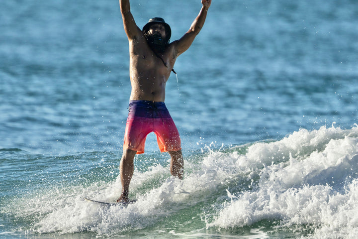 Island Texture Vast Performance Boardshort On A Surfboard